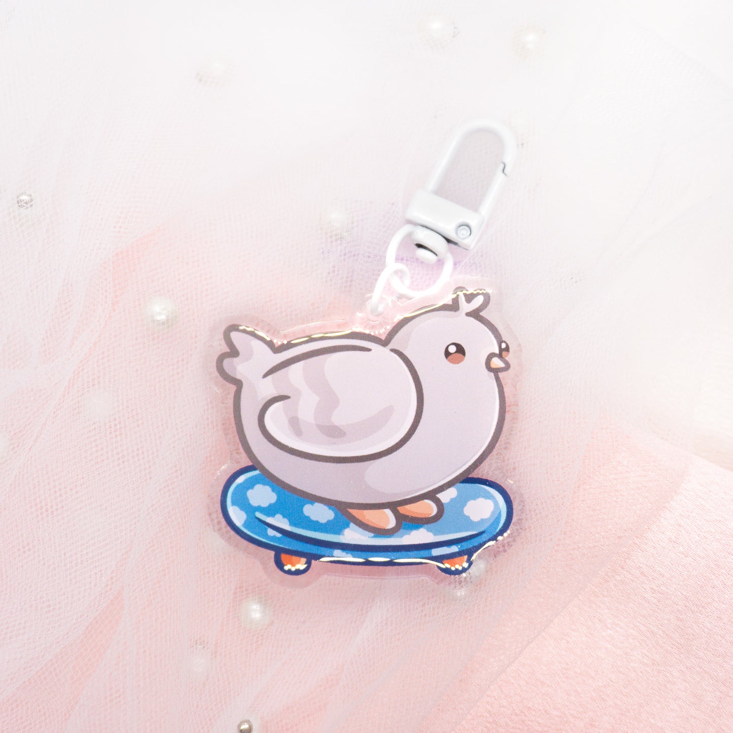 Kawaii pigeon with magic wand or skateboard keychain